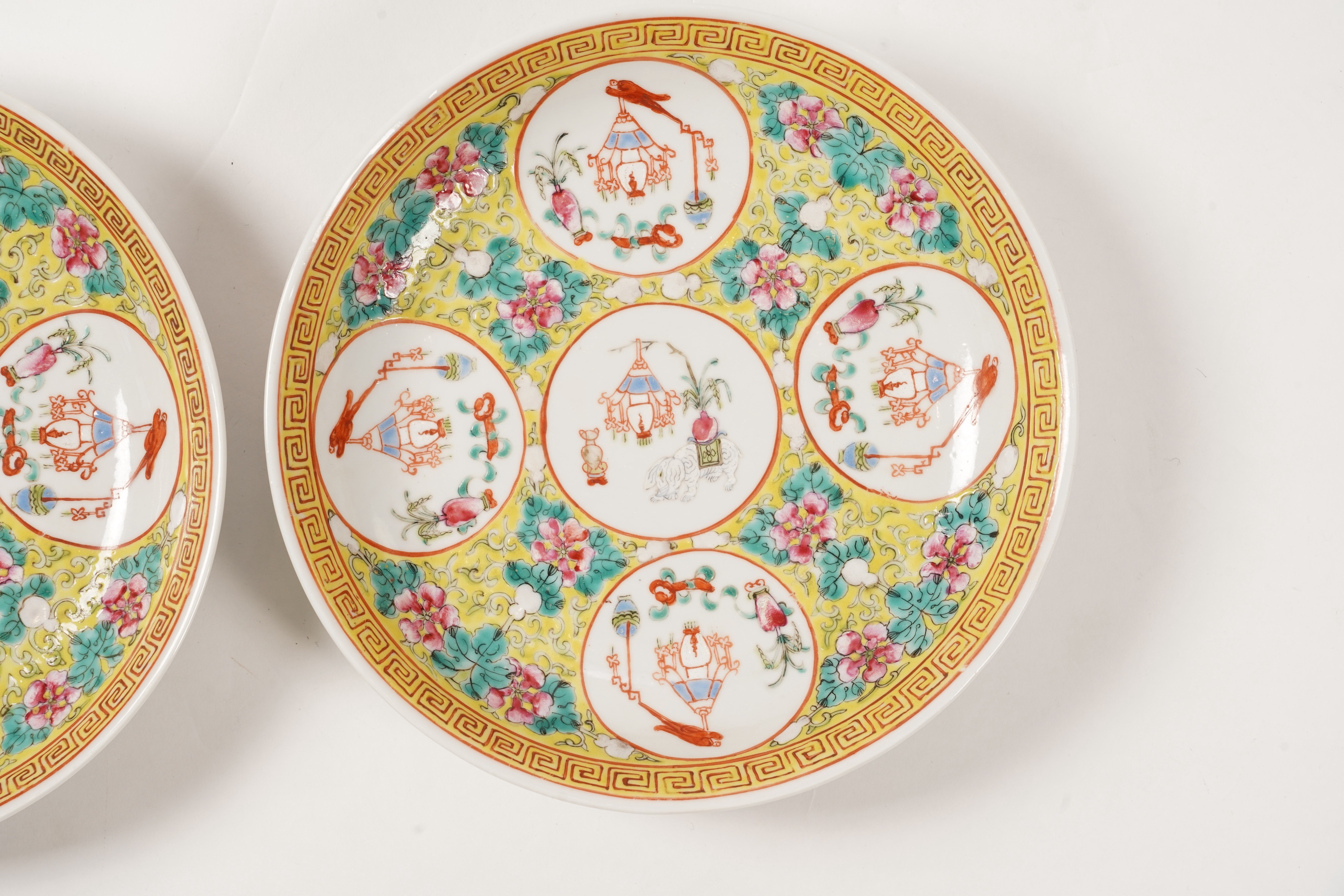 A pair of Chinese yellow ground medallion saucer dishes, Guangxu six character marks, early 20th century